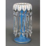 A 19th century bohemian cut-glass candle lustre with blue trumpet-shaped body & white overlaid lobed