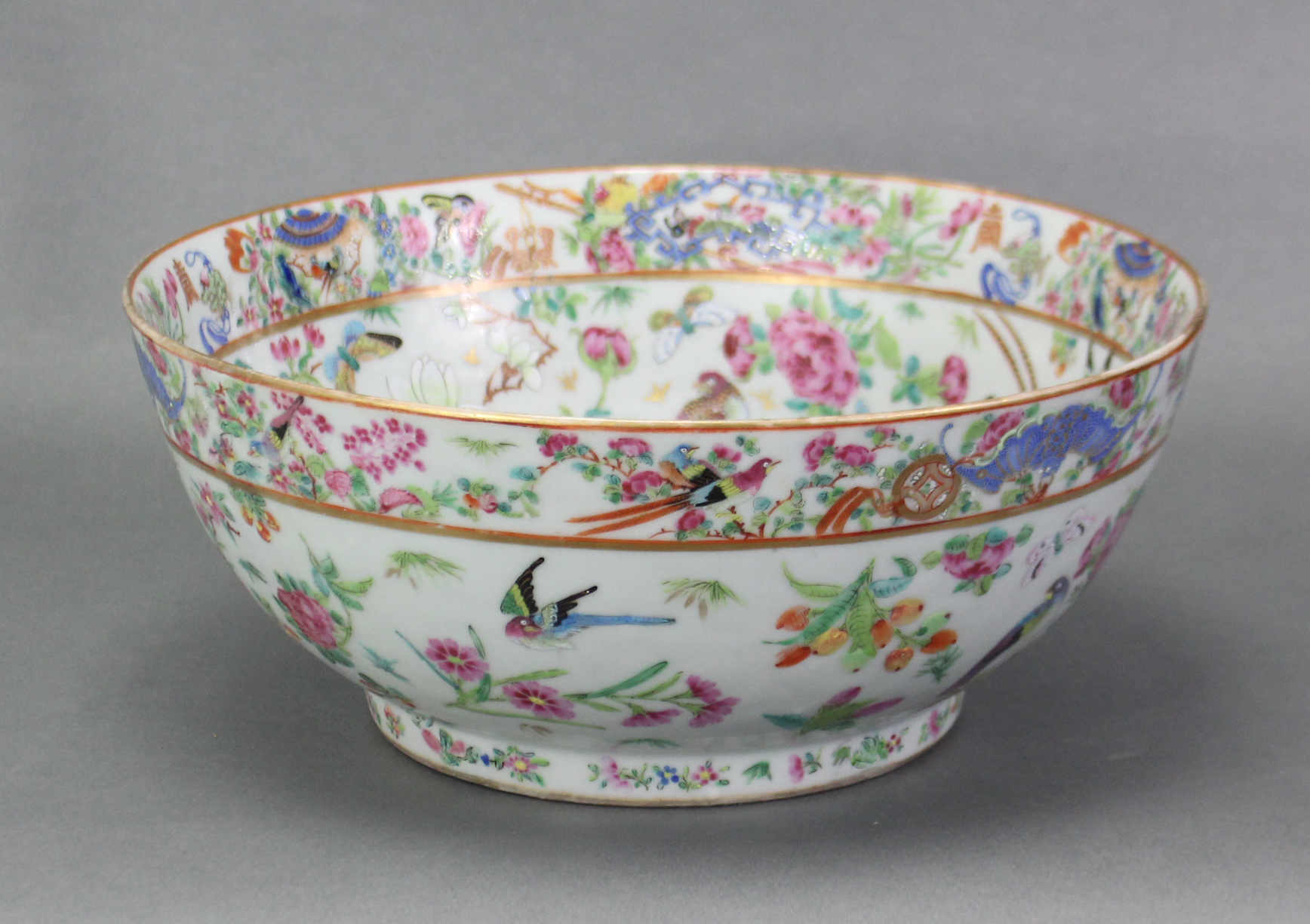 A 19th century Cantonese porcelain punch bowl, of celadon ground & with all-over famille rose - Image 4 of 7