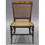 A late Victorian mahogany low chair by JAS. SHOOLBRED & CO, with cane seat & back, inlaid top rail