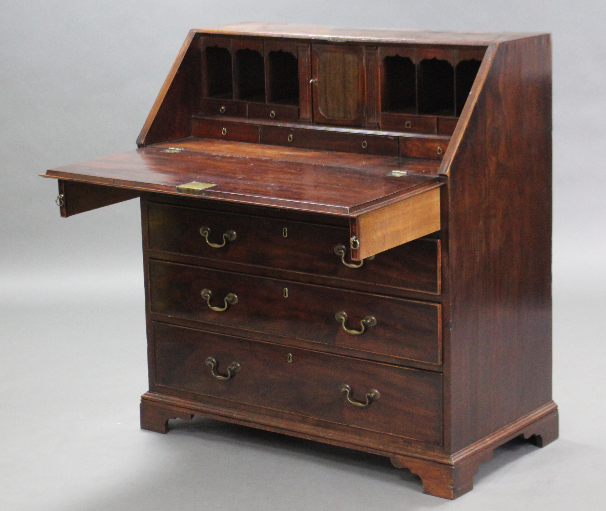 A George III mahogany bureau, the sloping fall-front enclosing a fitted interior above two short & - Image 2 of 3