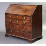 A George III mahogany bureau, with sloping fall-front enclosing a fitted interior, above four long