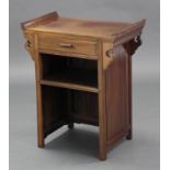 A Chinese hardwood low side cabinet, the rectangular top with carved scroll ends, fitted frieze