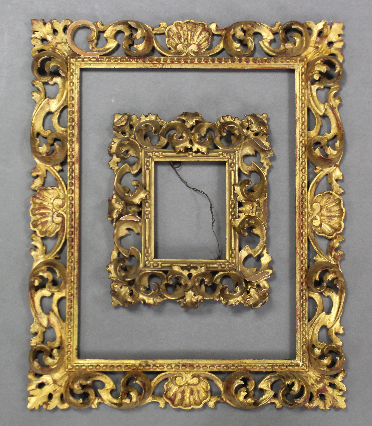 A set of four carved giltwood rectangular Florentine picture frames; 20½” x 17” over-all; & a