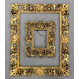 A set of four carved giltwood rectangular Florentine picture frames; 20½” x 17” over-all; & a