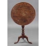 A George III mahogany tripod table, the circular tilt-top on ring-turned centre column & cabriole