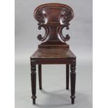 A William IV carved mahogany hall chair with turned & fluted front legs.