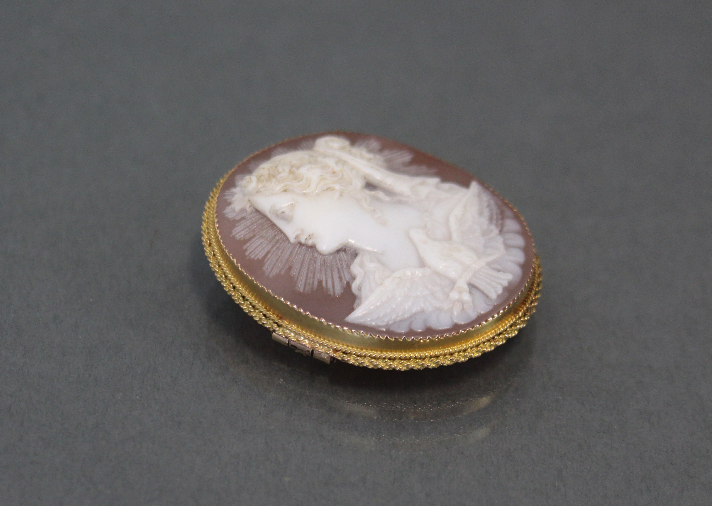 A carved shell oval cameo brooch depicting a classical female bust & a dove with wings spread, 1?” x - Image 2 of 4