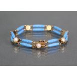 A 19th century gold, enamel, & pearl flexible bracelet comprised of parallel pairs of pale blue &