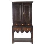 AN EARLY 18th century JOINED OAK CABINET ON STAND, of diminutive proportions, fitted two shelves