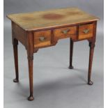 A Georgian mahogany lowboy, the plain rectangular top with moulded edge, fitted three frieze drawers