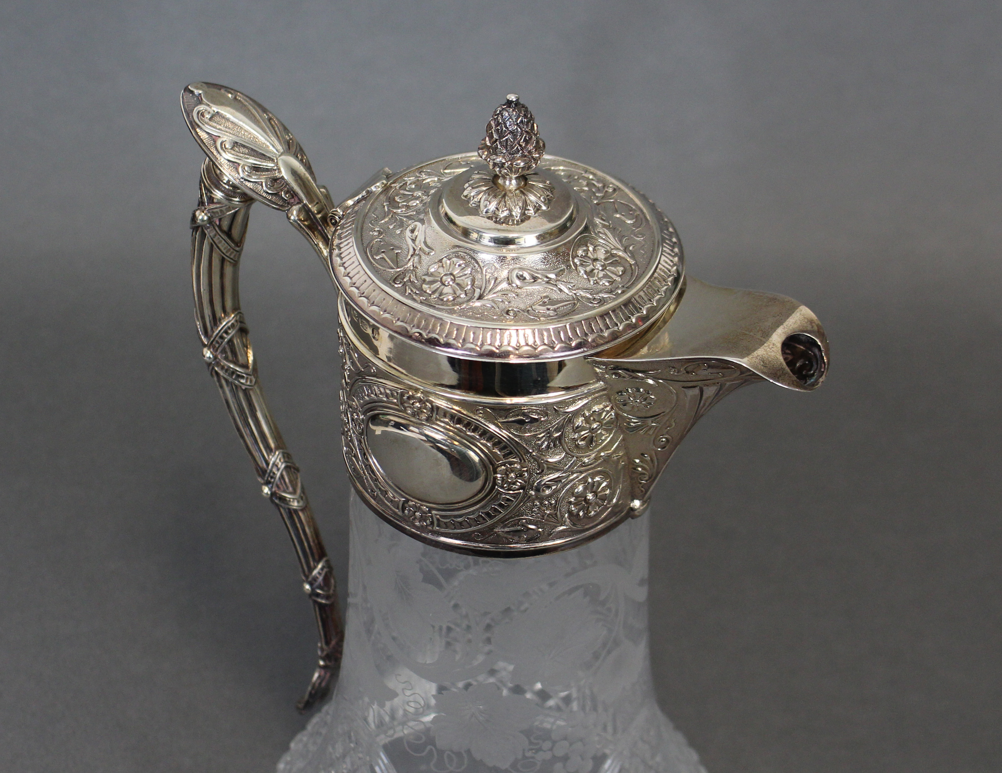 A VICTORIAN SILVER-MOUNTED CLARET JUG, the broad silver neck-mount, hinged lid, & enclosed spout - Image 2 of 3