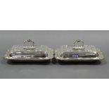A pair of rectangular entrée dishes with cast foliate borders & detachable leaf-scroll ring handles;