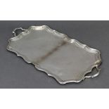 A mid-20th century silver rectangular two-handled tray with raised pie-crust border, 16½” x 8¾”;