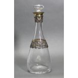 An Asprey silver-mounted glass decanter of slender baluster form, with mushroom stopper, silver