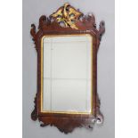A 19th century mahogany Swansea-type rectangular wall mirror in fret-carved scroll frame with gilt
