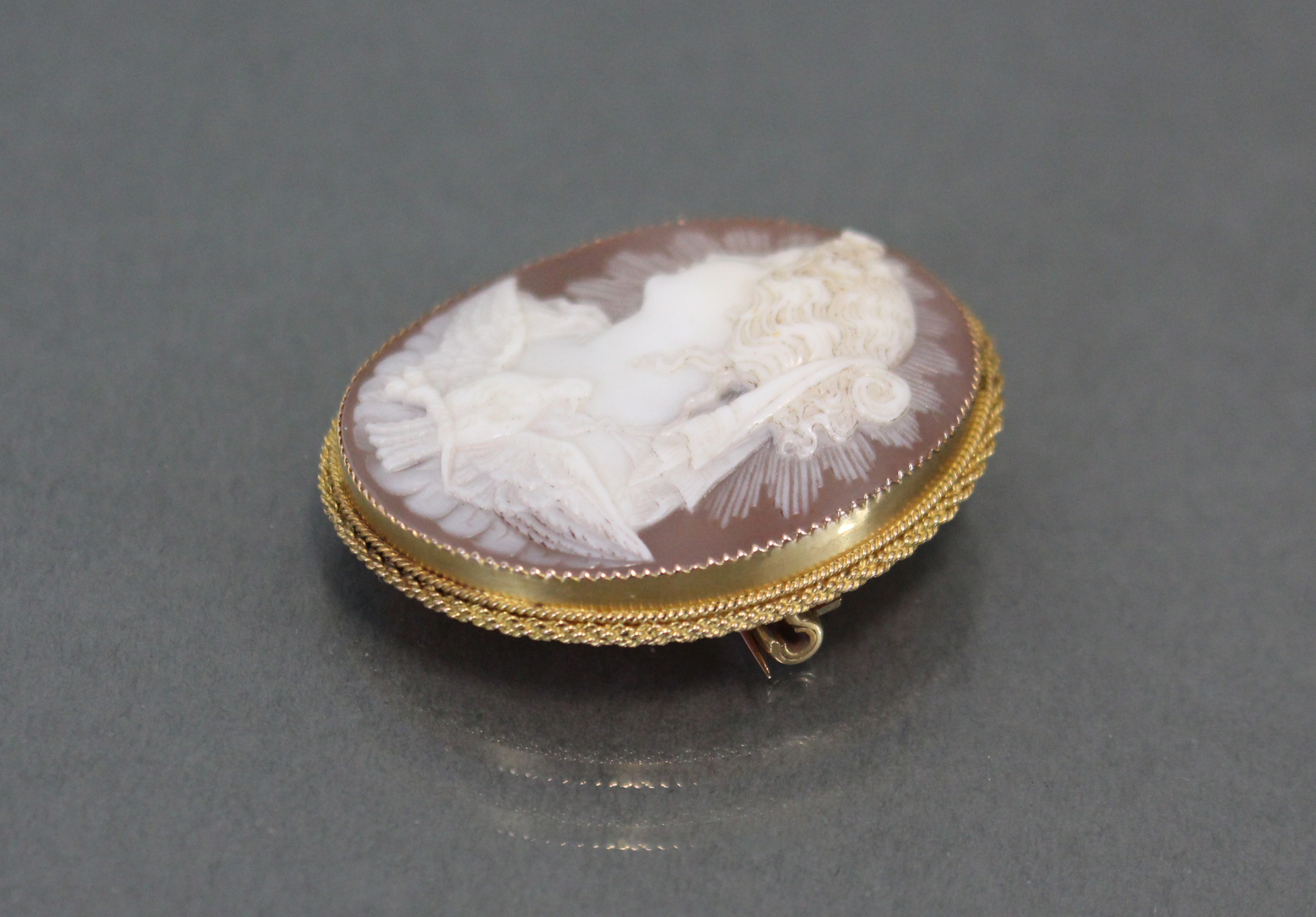 A carved shell oval cameo brooch depicting a classical female bust & a dove with wings spread, 1?” x - Image 3 of 4