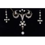 A Belle Epoque gold, diamond & pearl brooch, & pair of matching earrings, the brooch of open-work