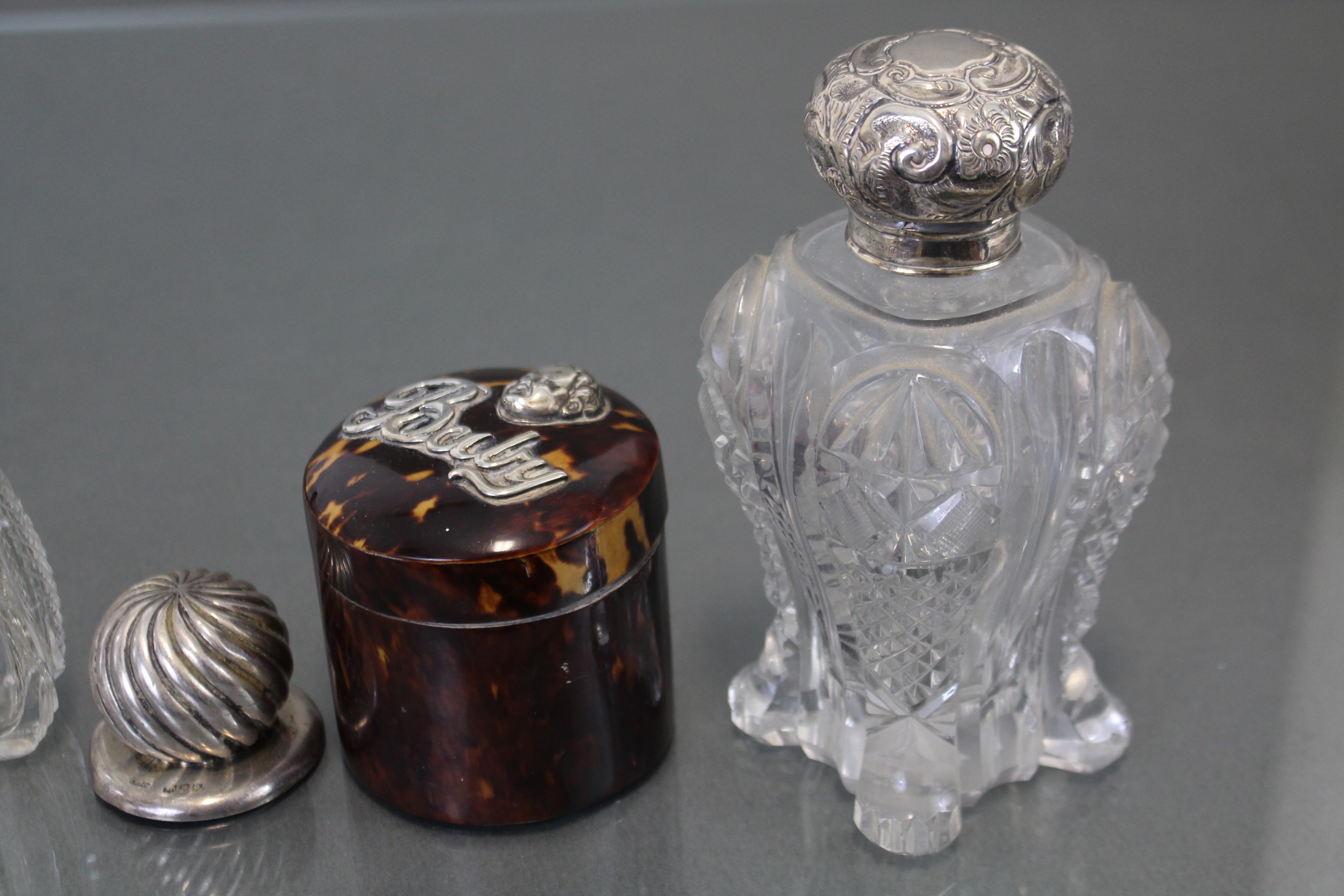 A pair of Edwardian cut glass water bottles with silver lids, London 1903 (w.a.f.); a similar - Image 3 of 5