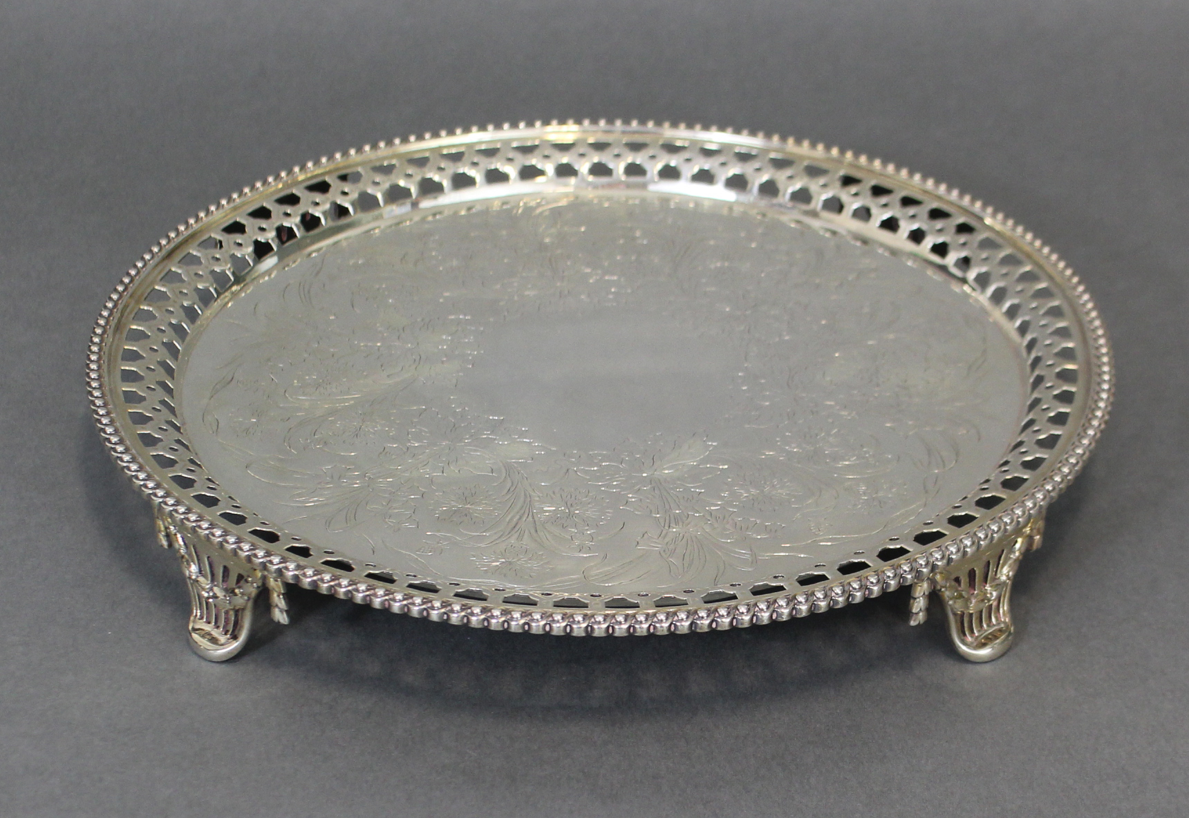 A Victorian silver circular tray with engraved floral decoration, the pierced border with - Image 2 of 3