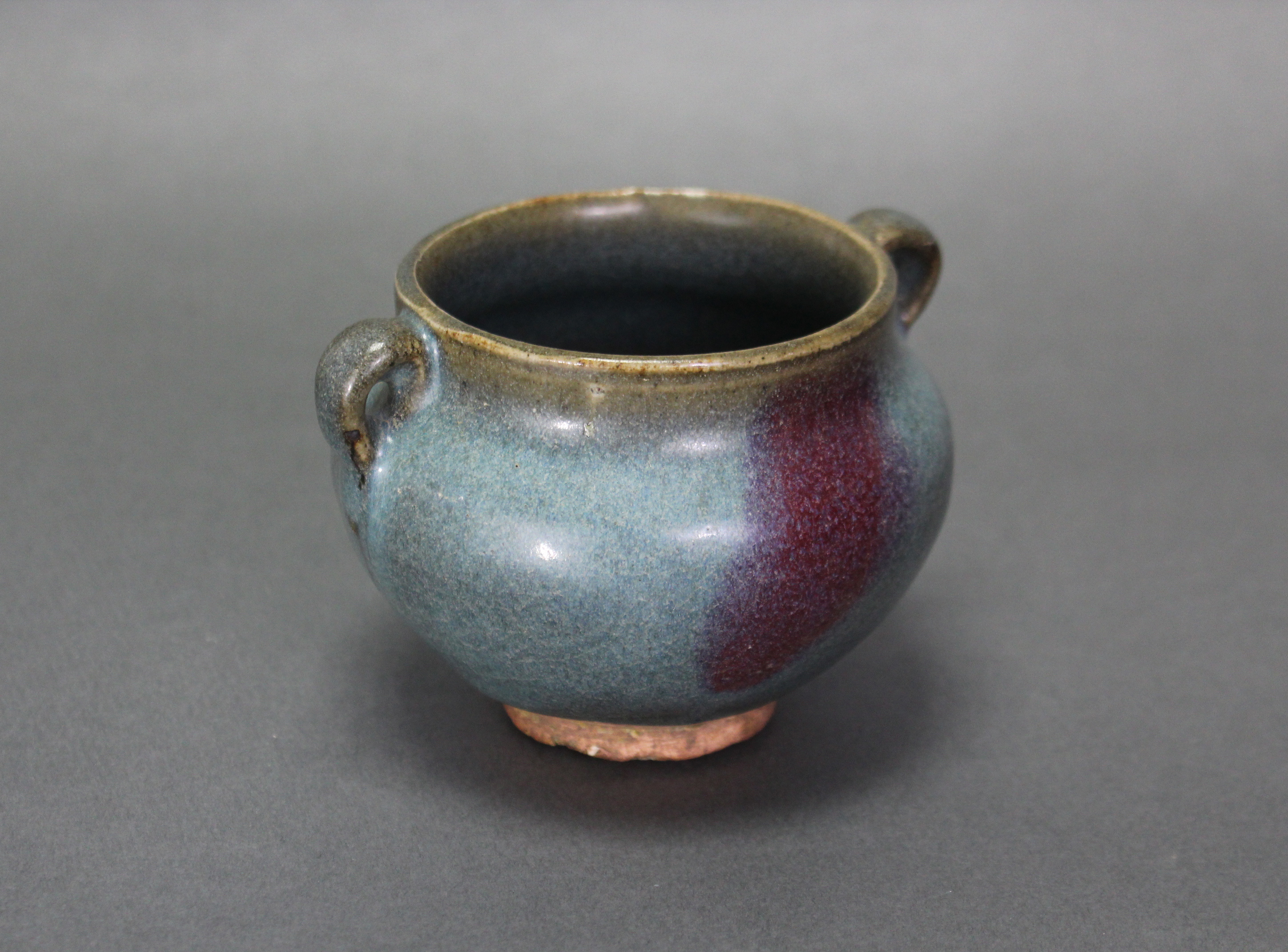 A Chinese Junyao-type pottery jarlet of compressed round form with small ring side-handles, a purple - Image 4 of 5