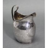 A George III silver helmet-shaped milk jug, with engraved laurel-wreath cartouche, & with loop
