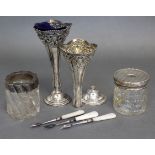 A pair of late Victorian silver posy vases with pierced necks, 6½“ high, Chester 1899 (maker’s