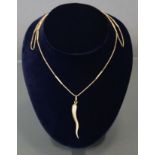 A 9ct. gold chain necklace of gaspipe links with batons at intervals, 33” long (15.6gm) & a yellow