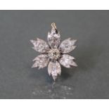 A DIAMOND FLOWER-HEAD PENDANT, the centre stone approximately 0.5 carat, surrounded by six petals
