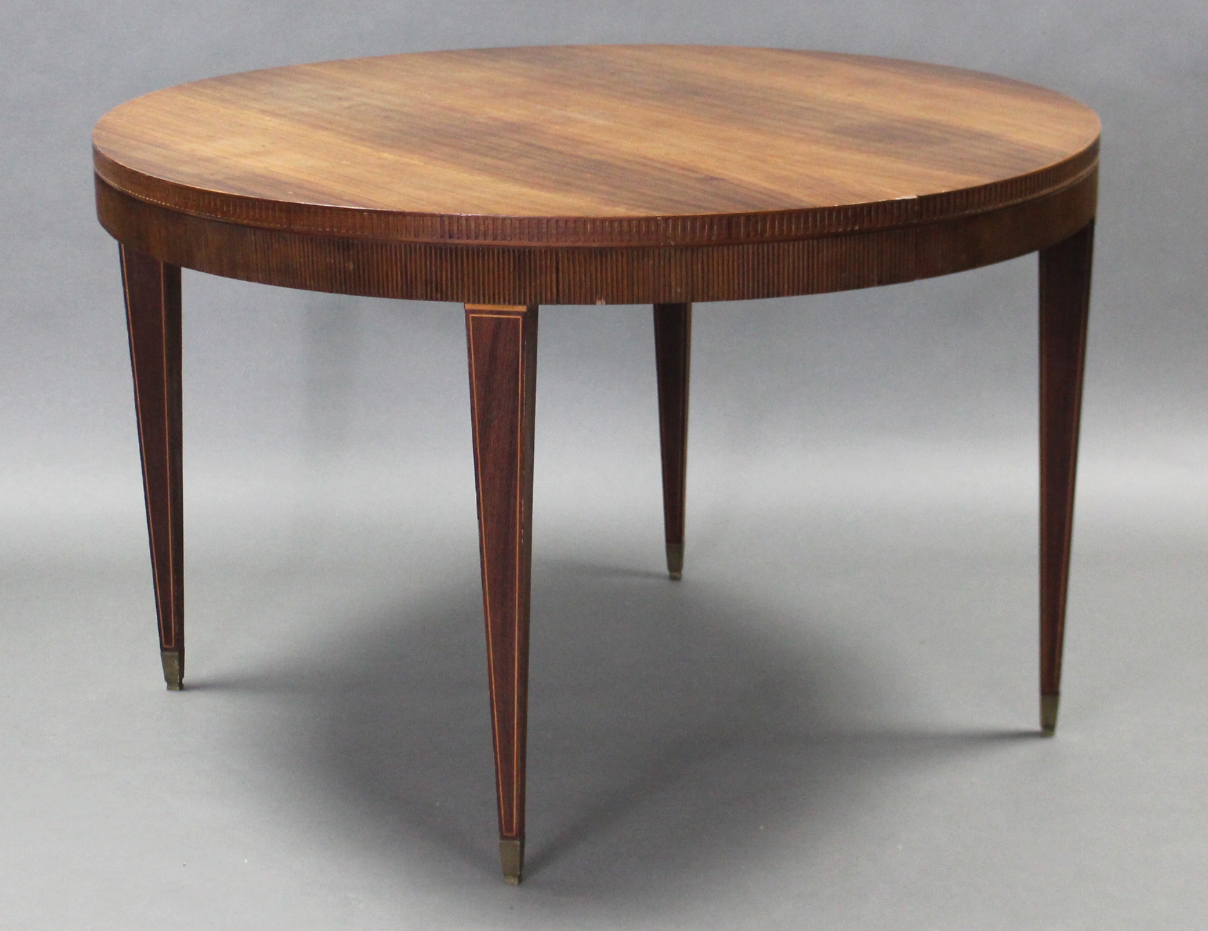 A 19th century French inlaid-rosewood extending dining table, the circular top with carved &