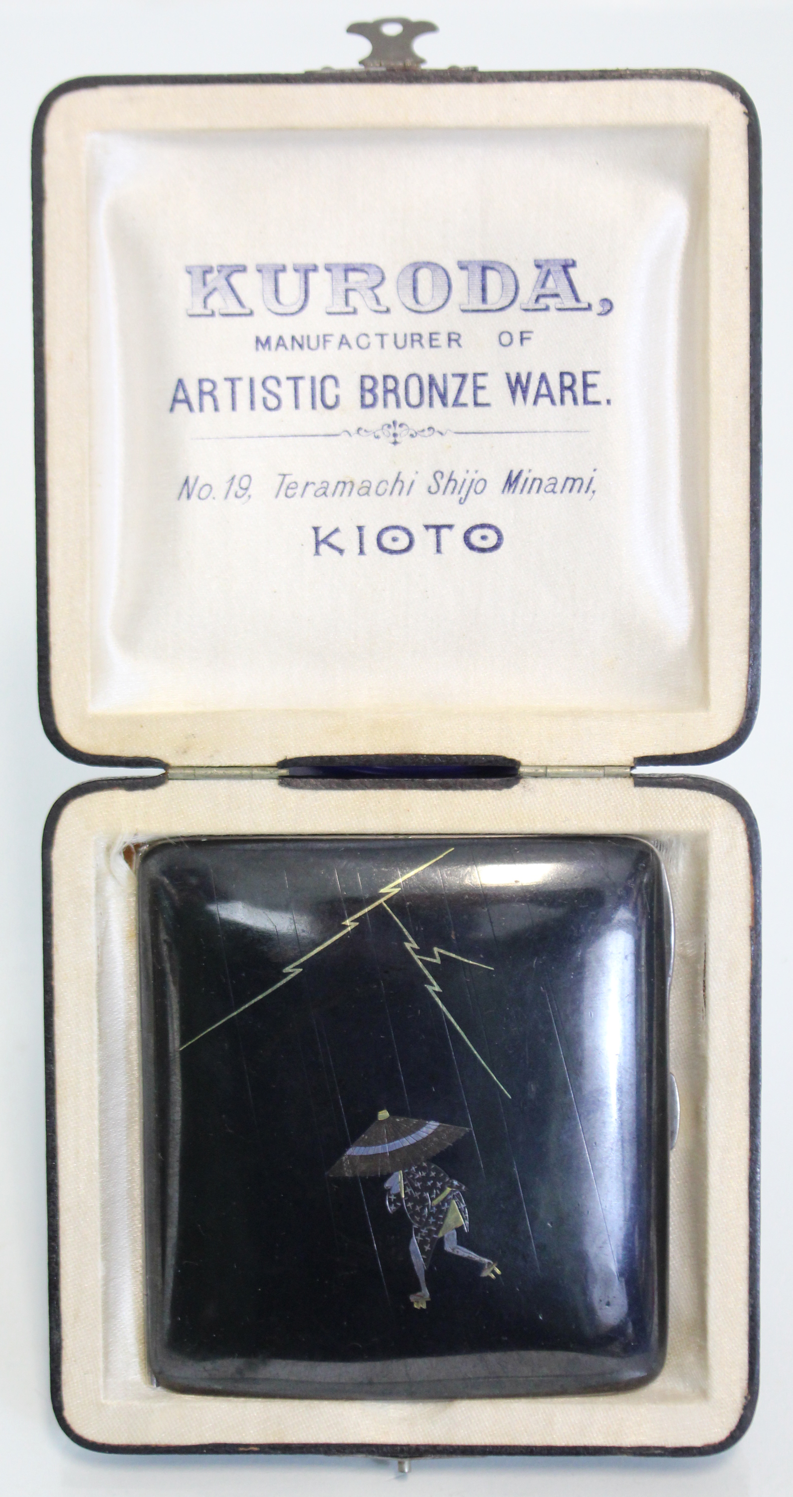 A Japanese mixed metal pocket cigarette case by Kuroda of Kioto, decorated with a figure
