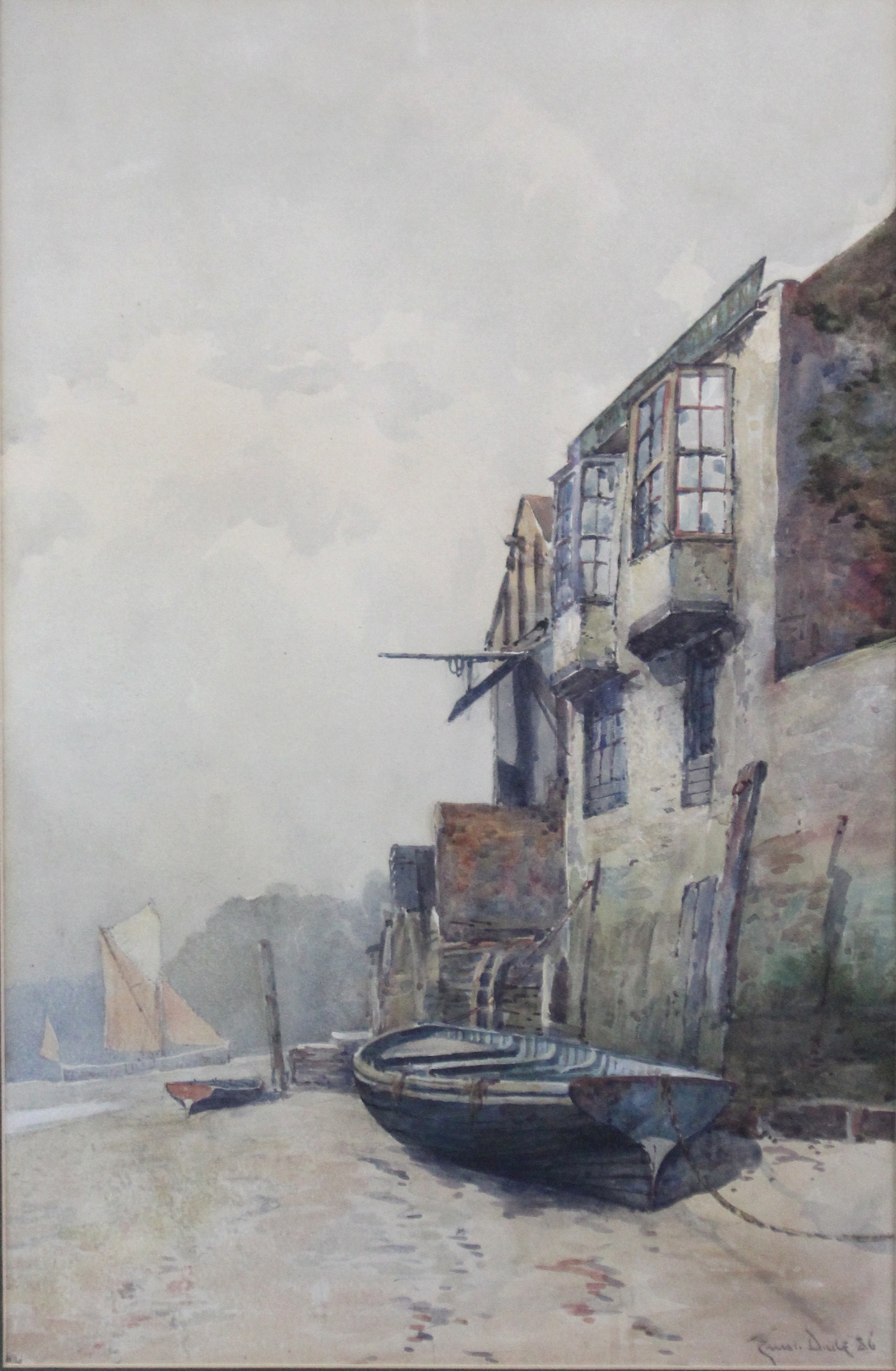 ERNEST DADE (1868-1936). Beached fishing vessels beside a row of buildings. Signed & dated ’86 lower