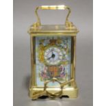 A Halcyon Days brass carriage timepiece commemorating the 2002 Golden Jubilee of Queen Elizabeth II,