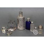 A Victorian silver-mounted glass scent bottle with embossed romantic figure decoration, London