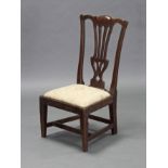 A 19th century Chippendale-style oak child’s chair, with pierced splat to the shaped back, padded