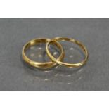 A late Victorian 22ct. gold wedding band, London hallmarks for 1893, size: M (3.2gm); & another,