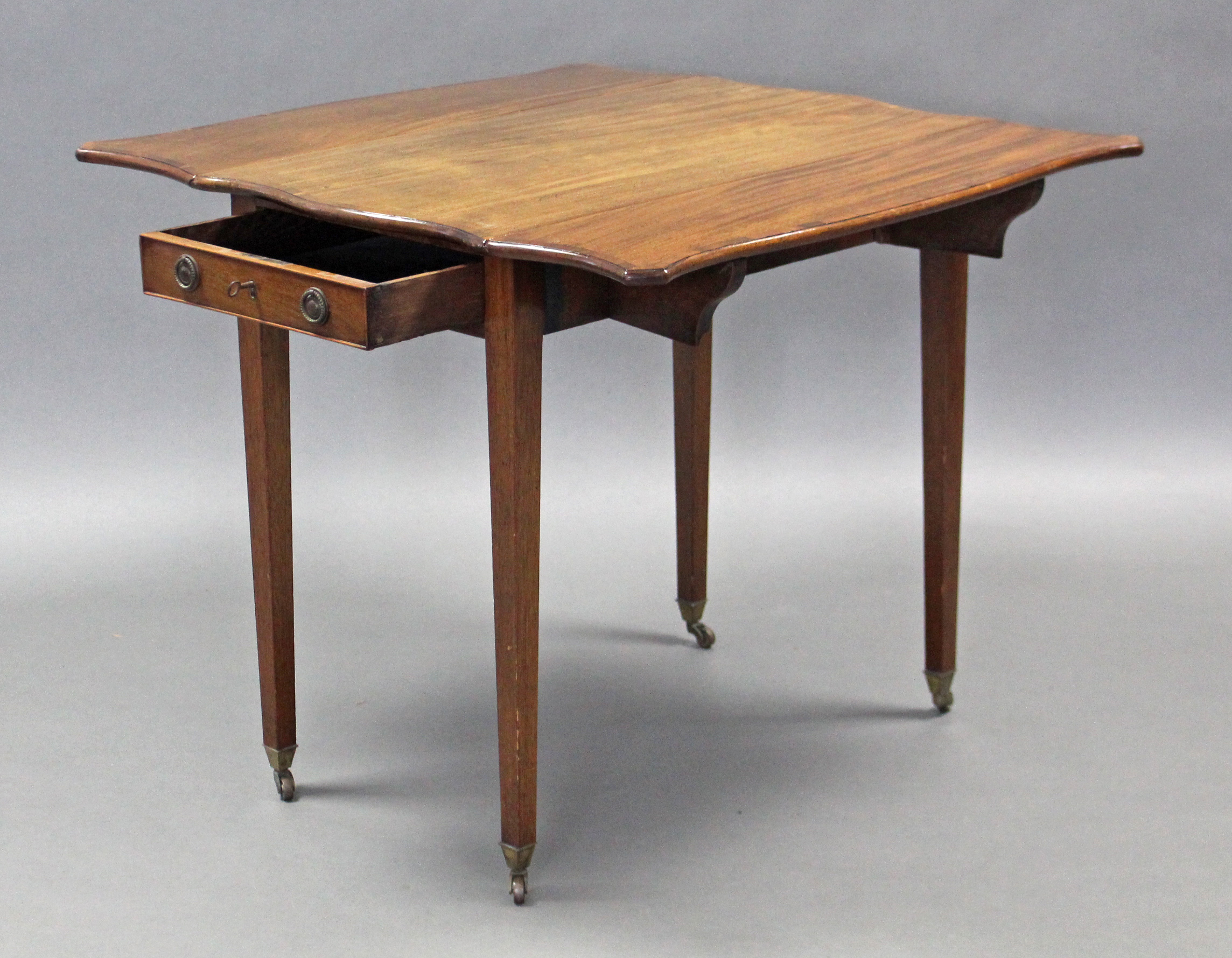 A George III mahogany Pembroke table of serpentine outline, the crossbanded top with canted corners, - Image 2 of 4