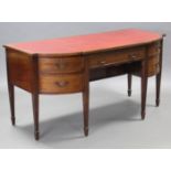 A 19th century mahogany bow-front sideboard, the shaped top inset crimson gilt-tooled leather