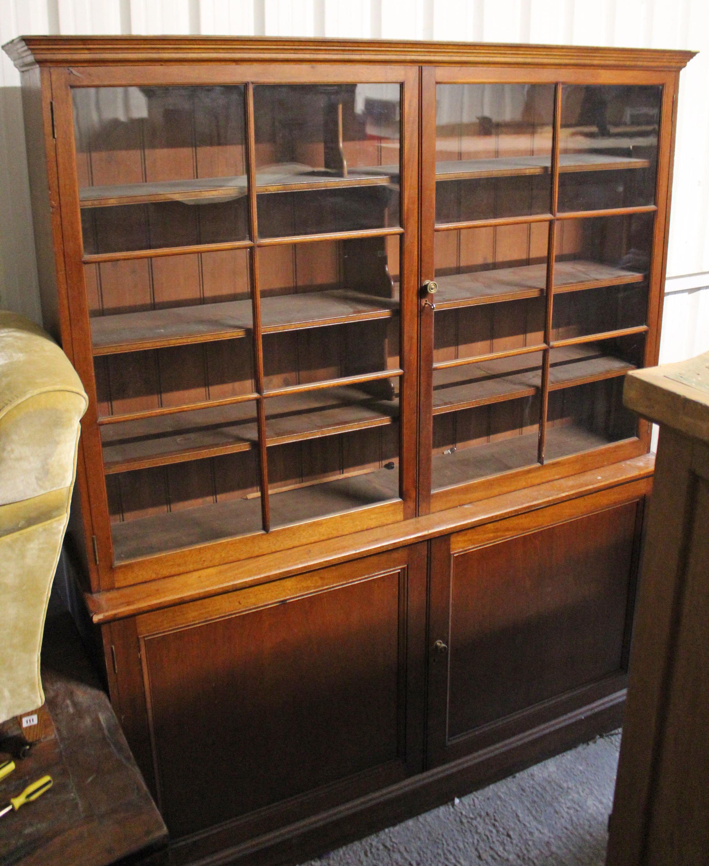 AN EARLY VICTORIAN MAHOGANY BOOKCASE, with moulded cornice above four graduated shelves enclosed - Image 2 of 10