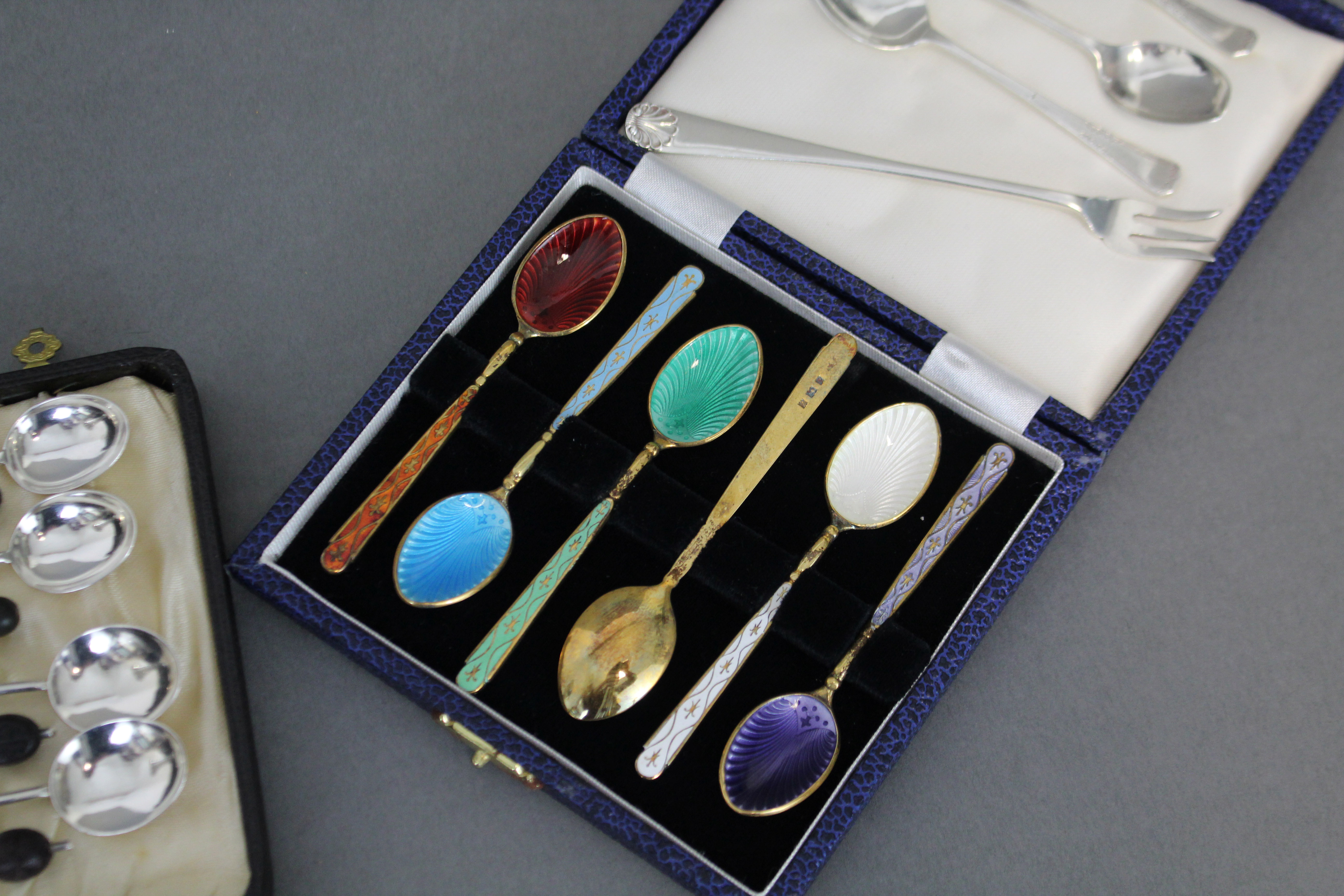A set of six silver-gilt & harlequin enamel coffee spoons, Birmingham 1974, in fitted case; a set of - Image 2 of 2