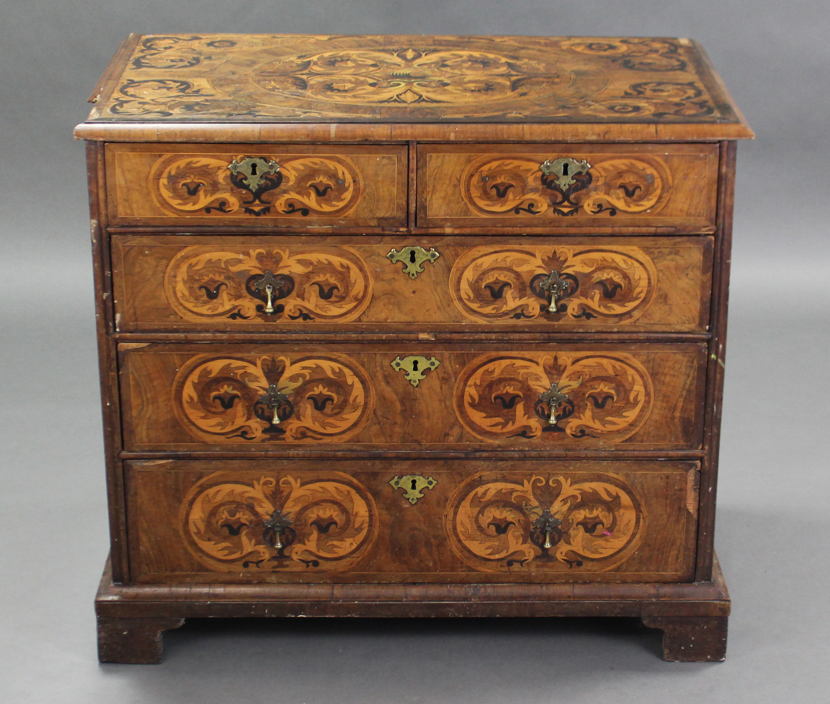 A WILLIAM & MARY WALNUT-VENEERED MARQUETRY CHEST, the quarter-veneered top with moulded edge &