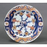 An 18th century Chinese Imari porcelain charger, the centre with landscape decoration & stylised