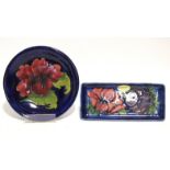 A modern Moorcroft “Anemone” rectangular shallow dish of mid-blue ground, 8” x 3½”; & a “Hibiscus”
