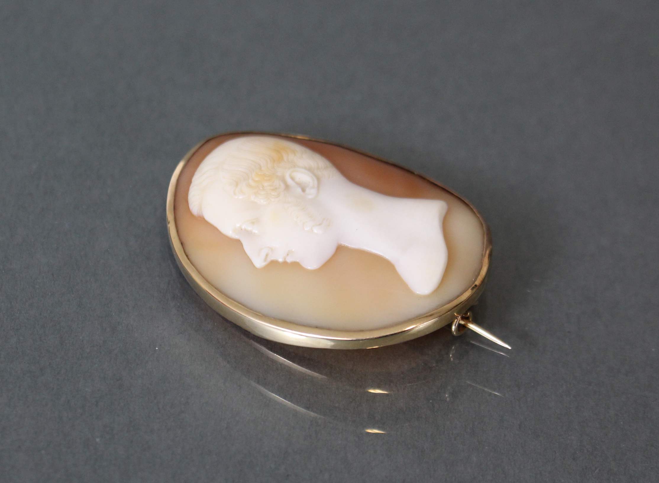 A Victorian carved shell oval cameo brooch depicting a male bust in profile, in plain gold mount; 2” - Image 2 of 3