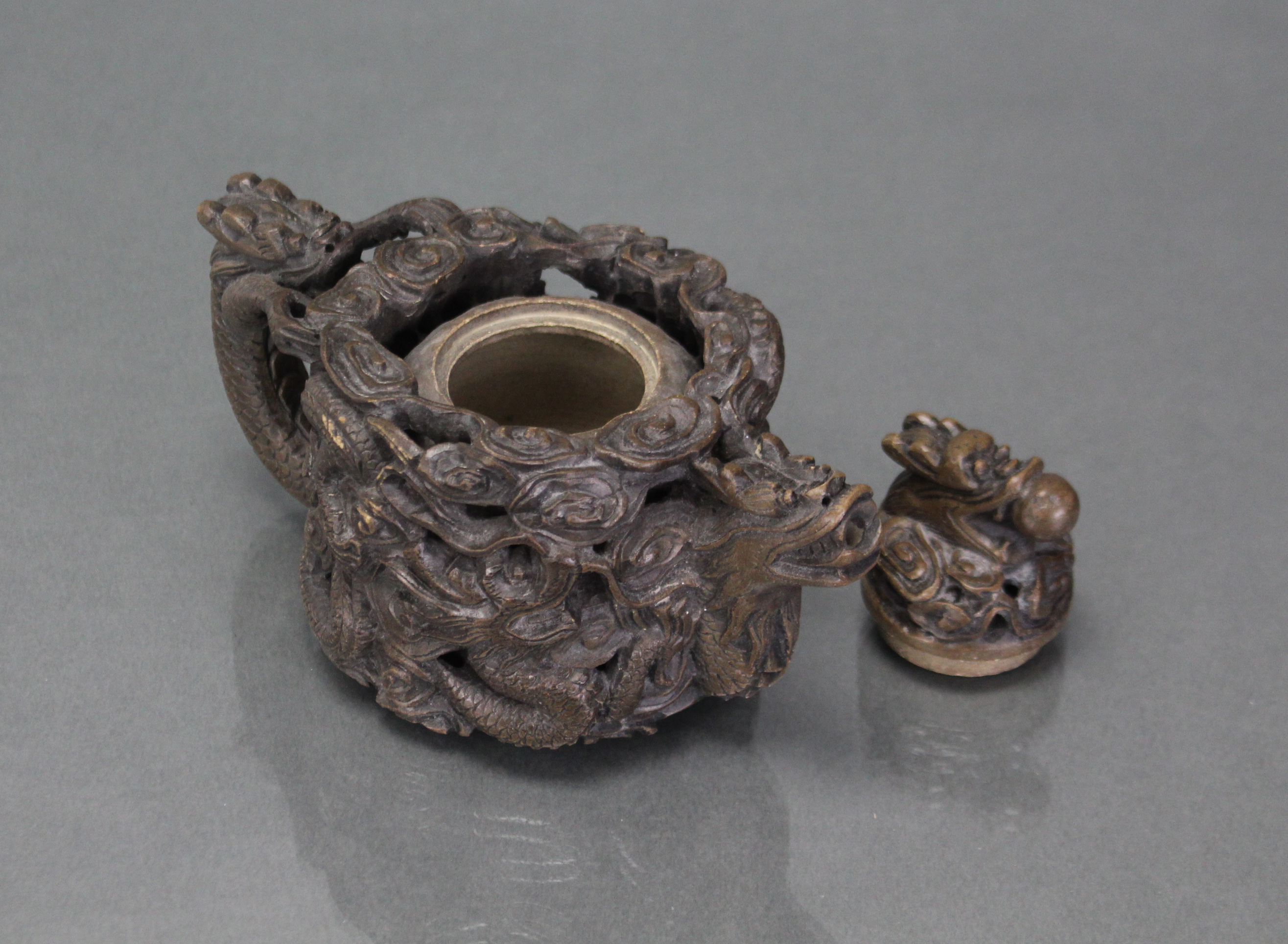 A Chinese soapstone reticulated teapot, deeply carved & pierced with encircling dragons, with - Image 3 of 4