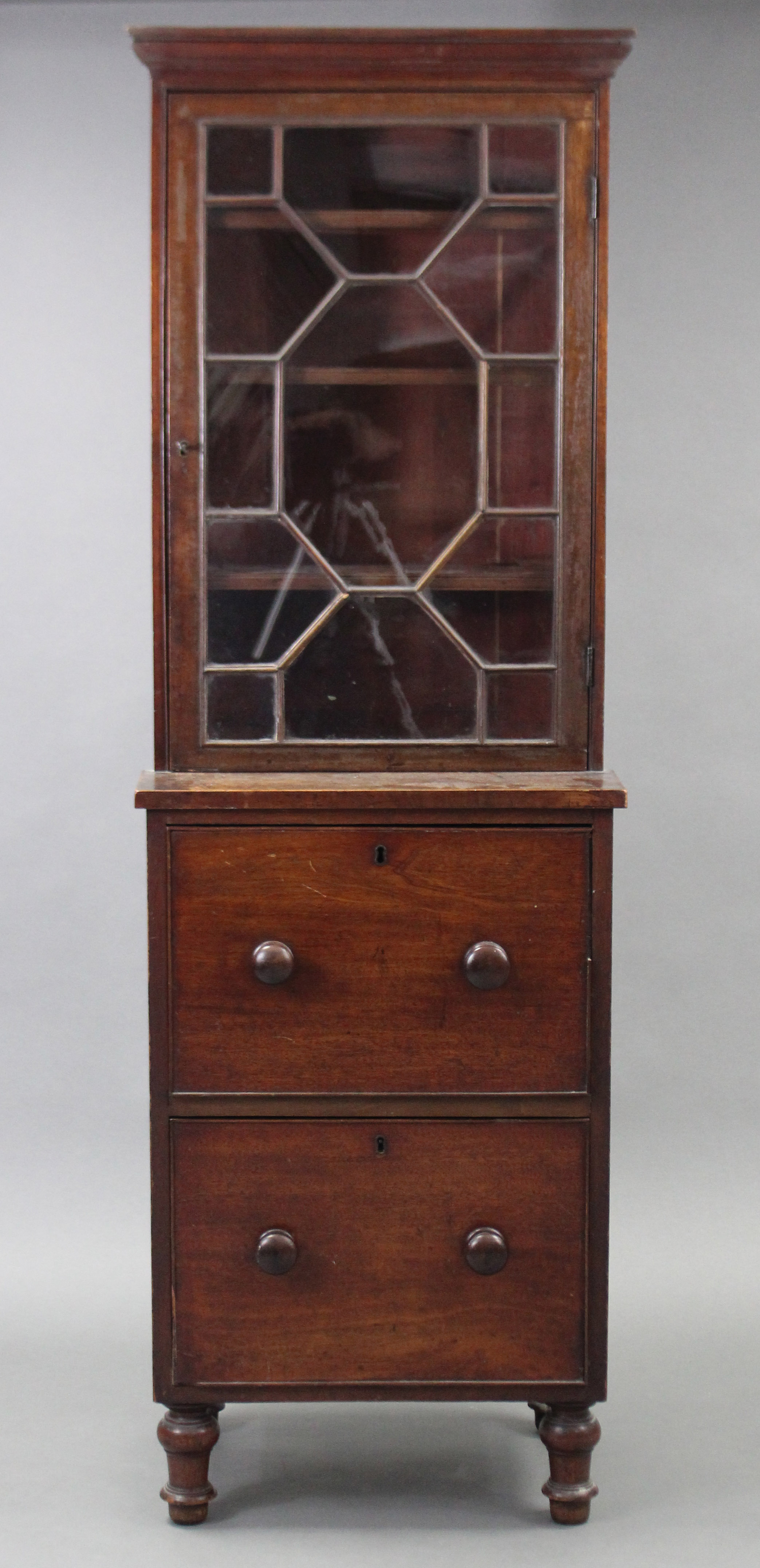 A Victorian small cabinet, fitted three adjustable shelves enclosed by astragal glazed door above