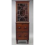 A Victorian small cabinet, fitted three adjustable shelves enclosed by astragal glazed door above