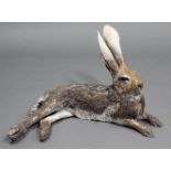 NICK MACKMAN; a contemporary ceramic sculpture titled: “Lying Down Hare”, glazed in naturalistic