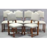 A set of twelve Cromwellian style oak dining chairs, including a pair of carver chairs, with