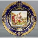 A late 19th century Vienna porcelain cabinet plate, the centre with finely painted square panel
