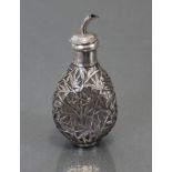 A Chinese silver-mounted glass vinaigrette bottle with dimpled sides, encased in cage-work bamboo